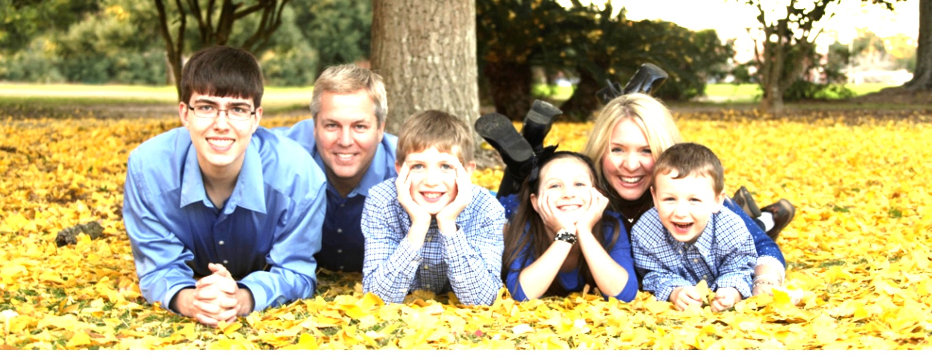 The Johnson family in fallen leaves