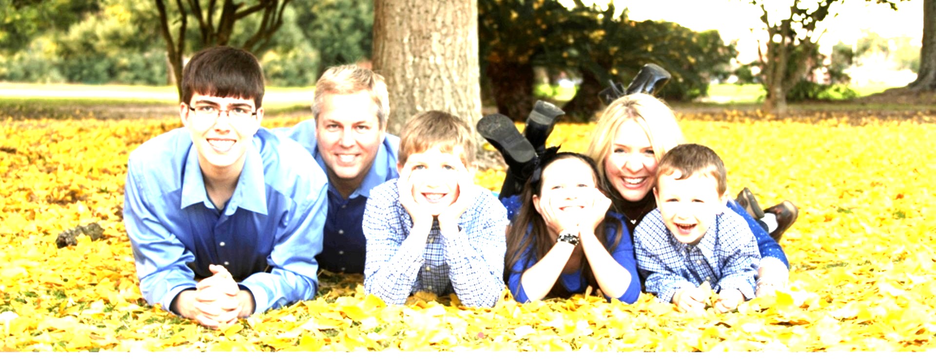 The Johnson family in fallen leaves